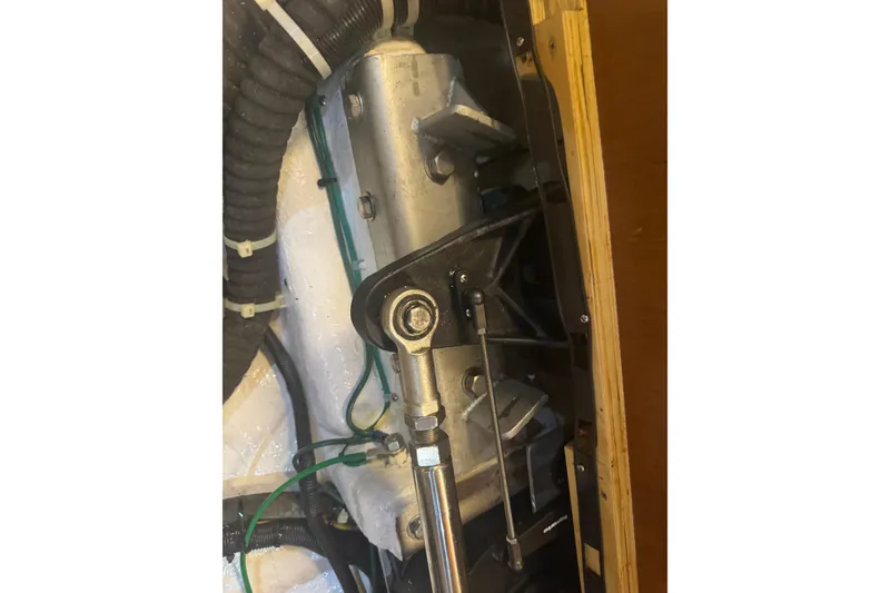 Slide: The Image of Engine compartment of a 2012 Hylas 49CC sailboat, showing mechanical components and hoses. - 212