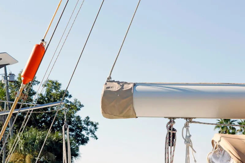 Slide: The Image of Sailboat rigging and boom on a 2012 Hylas 49CC under clear blue sky. - 27