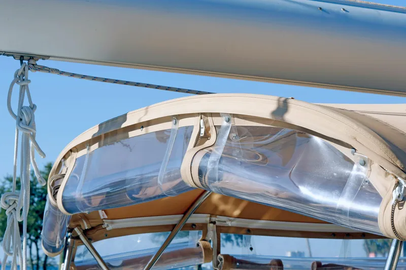 Slide: The Image of Close-up of a 2012 Hylas 49CC sailboat canopy with clear panels and rigging. - 28