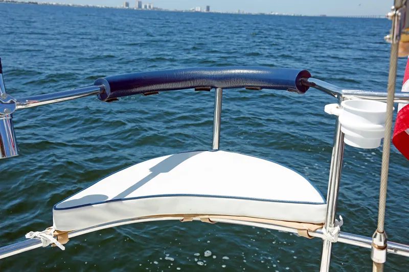 Slide: The Image of Sailboat stern view on water, Hylas 49CC, 2012 model, with city skyline in background. - 44