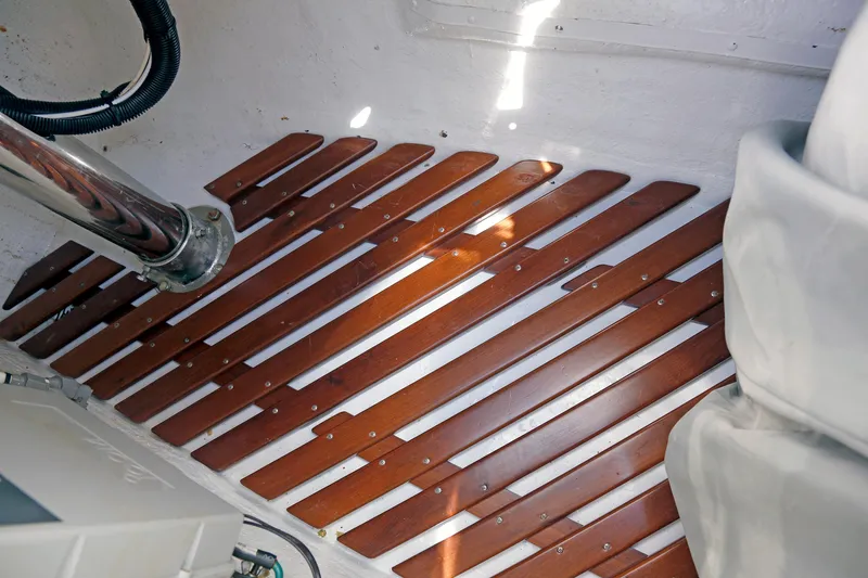 Slide: The Image of Wooden slatted flooring in a 2012 Hylas 49CC boat interior. - 51