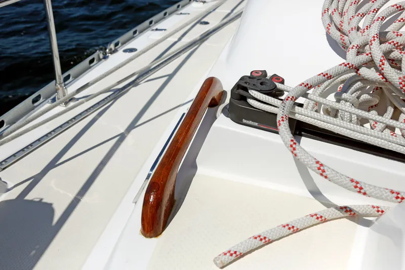 Slide: The Image of Deck of 2012 Hylas 49CC sailboat with ropes and wooden handrail. - 55