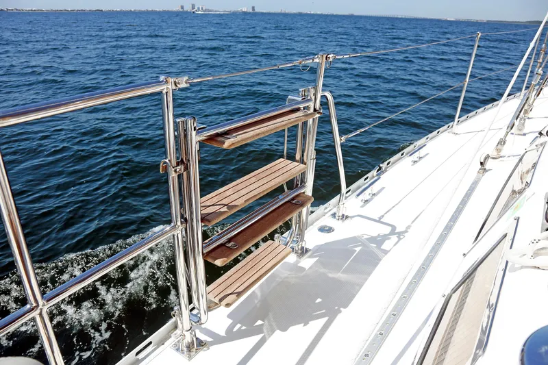 Slide: The Image of Sailing yacht Hylas 49CC 2012, featuring wooden steps and stainless steel railings on deck. - 57