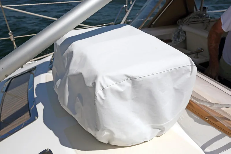 Slide: The Image of White cover on Hylas 49CC yacht deck, 2012 model, near water. - 65