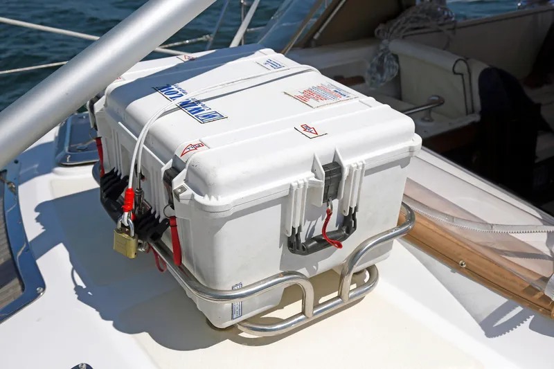 Slide: The Image of White storage box secured on a Hylas 49CC yacht, 2012 model, with padlock and cables. - 66
