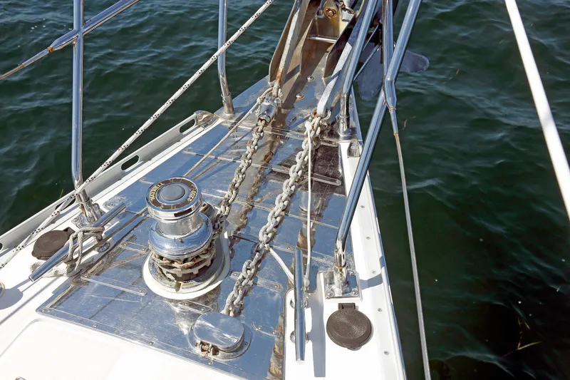 Slide: The Image of Bow of 2012 Hylas 49CC yacht with anchor chain and winch over water. - 67