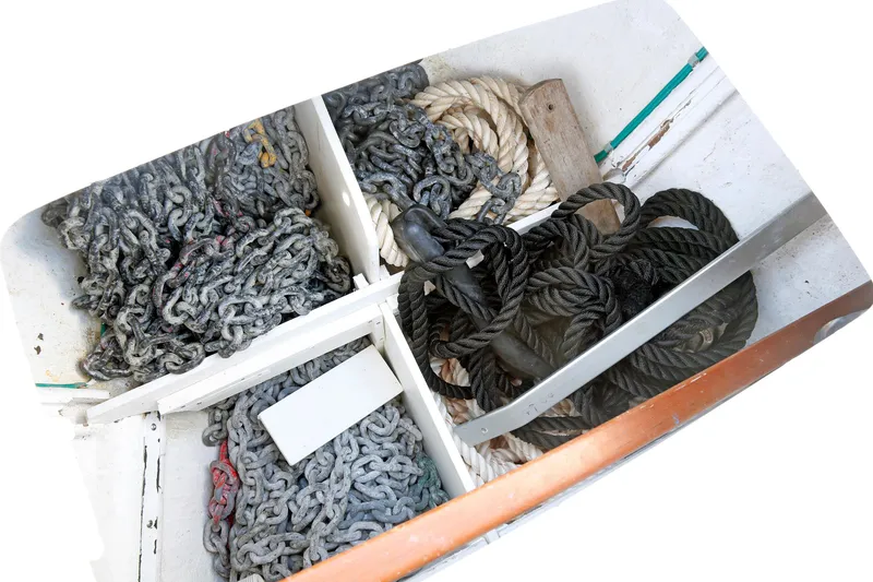 Slide: The Image of Storage compartment with chains and ropes on a 2012 Hylas 49CC boat. - 69