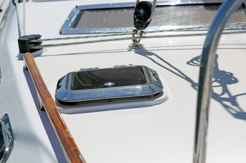 Slide: The Image of Close-up of a 2012 Hylas 49CC yacht deck with hatch and railing. - 73