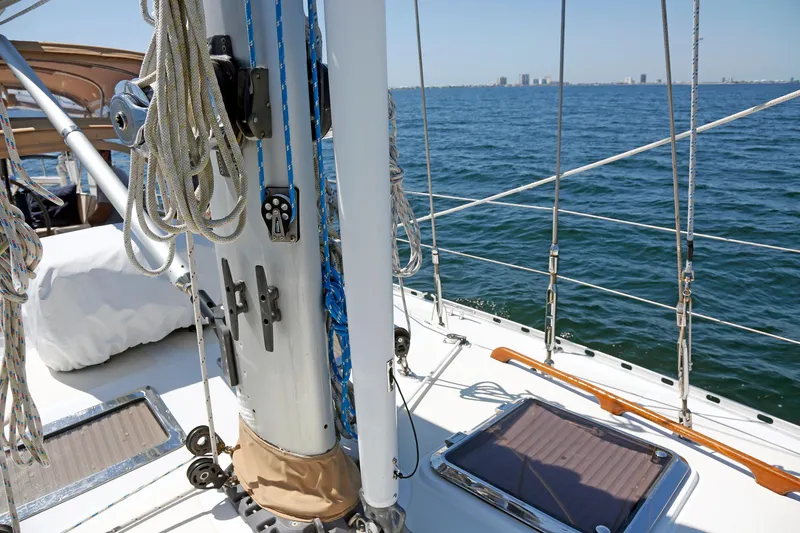 Slide: The Image of Sailboat deck view, Hylas 49CC, 2012 model, with ropes and ocean backdrop. - 75