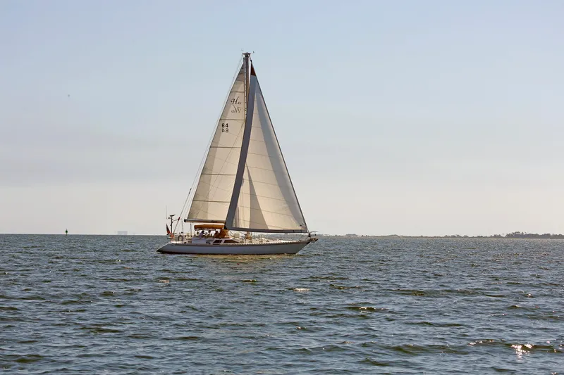 Slide: The Image of Sailboat on open water, Hylas 49CC, 2012 model, under clear sky. - 8