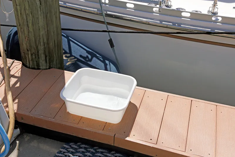 Slide: The Image of White basin on dock beside Hylas 49CC yacht, 2012 model. - 90