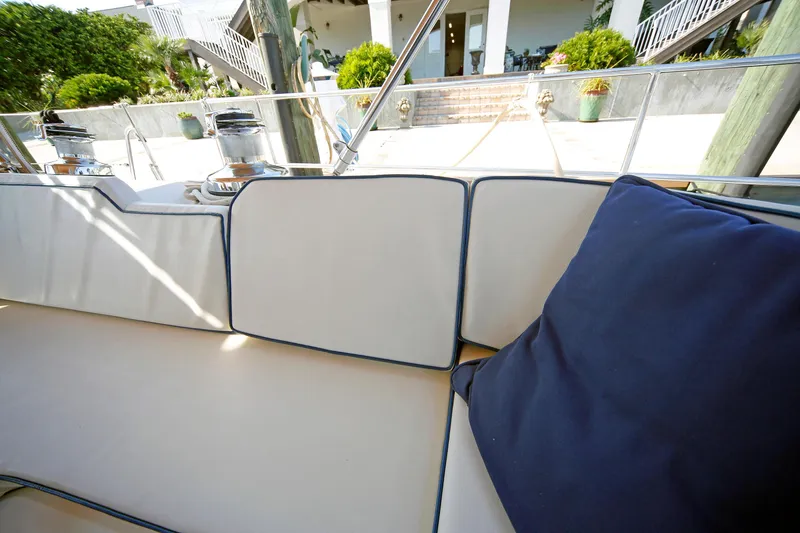 Slide: The Image of Luxurious seating area on a 2012 Hylas 49CC yacht, featuring plush cushions. - 96