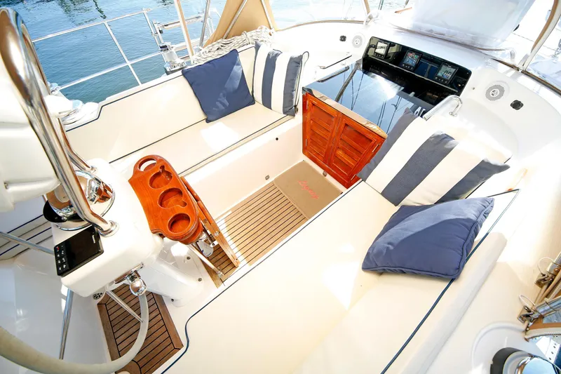 Slide: The Image of Luxurious 2012 Hylas 49CC yacht cockpit with plush seating and nautical decor. - 97