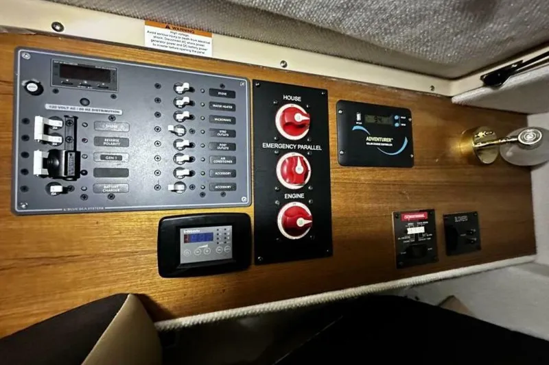 Slide: The Image of Control panel of a 2019 Ranger Tugs R-23 boat with various switches and gauges. - 13