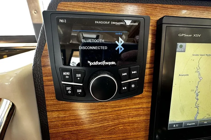 Slide: The Image of Boat dashboard with Rockford Fosgate Bluetooth stereo and GPS map display on Ranger Tugs R-23, 2019. - 19