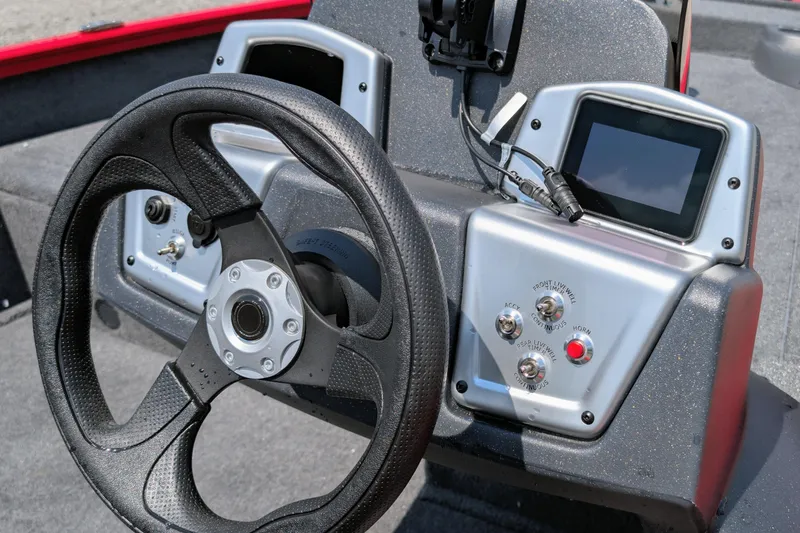 Slide: The Image of Steering console of 2026 Tracker Pro Team 175 Crappie Edition boat with control panel. - 4
