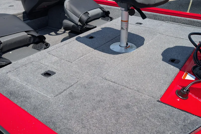 Slide: The Image of 2026 Tracker Pro Team 175 Crappie Edition boat interior with gray carpet and seating. - 7