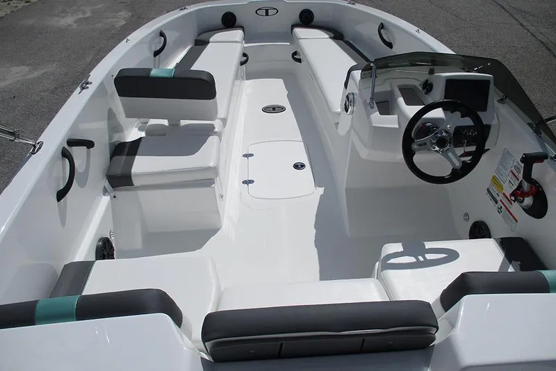 Slide: The Image of 2026 Tahoe T18 boat interior with seating, steering wheel, and control panel. - 10