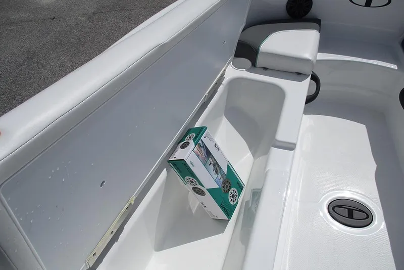 Slide: The Image of Interior of 2026 Tahoe T18 boat with storage compartment and speaker box. - 12