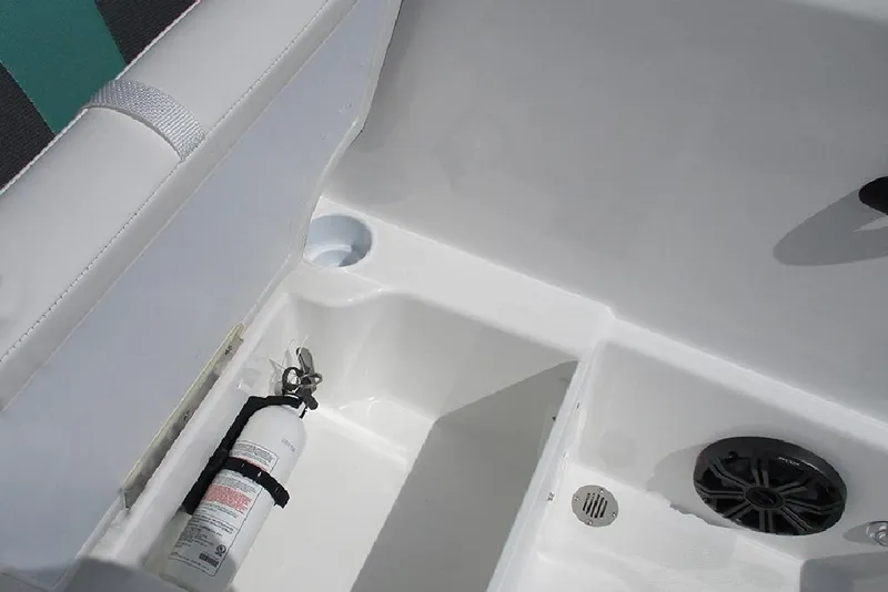 Slide: The Image of 2026 Tahoe T18 boat interior with fire extinguisher and speaker. - 17