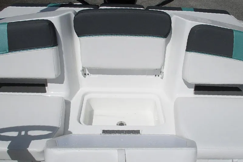 Slide: The Image of 2026 Tahoe T18 boat interior with cushioned seating and storage compartment. - 18