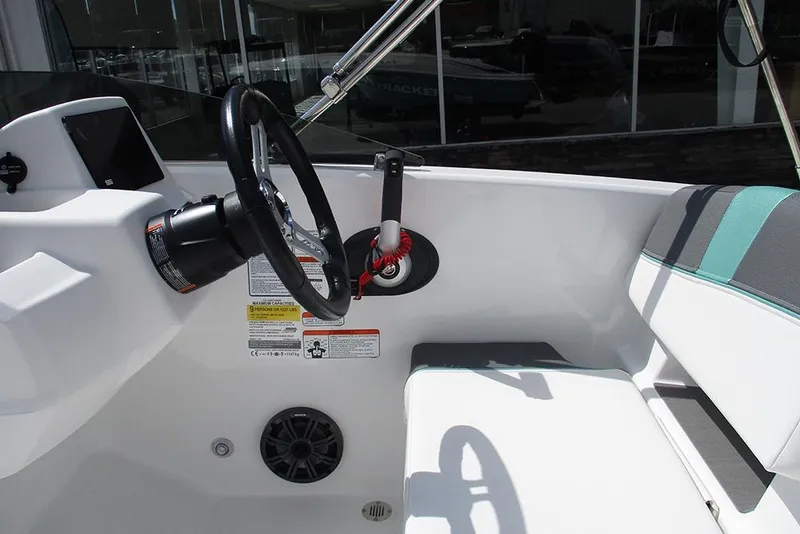 Slide: The Image of 2026 Tahoe T18 boat interior with steering wheel and seating. - 19