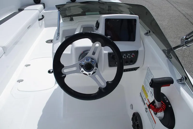 Slide: The Image of 2026 Tahoe T18 boat cockpit with steering wheel and control panel. - 26