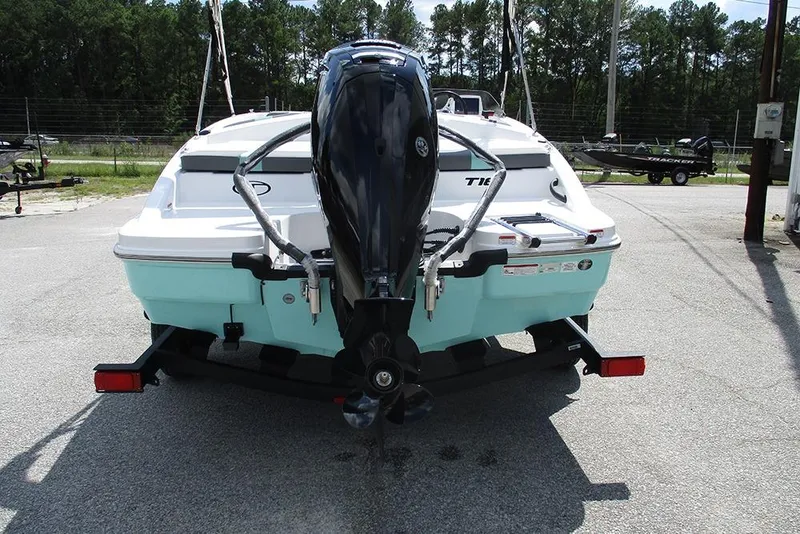 Slide: The Image of 2026 Tahoe T18 boat rear view with outboard motor on trailer. - 8
