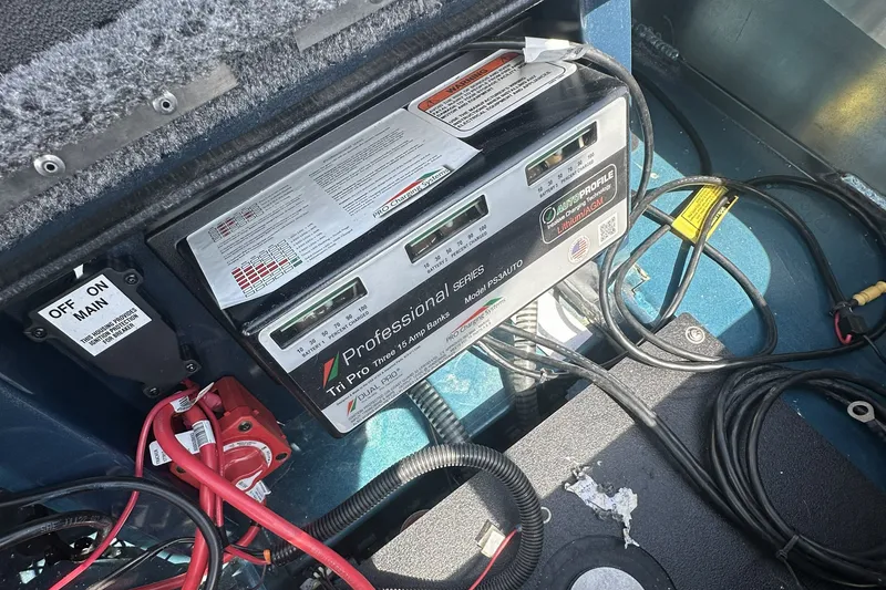 Slide: The Image of Electrical system setup in a 2025 Ranger ALPHA 208 boat, featuring a Tri Pro charger. - 13