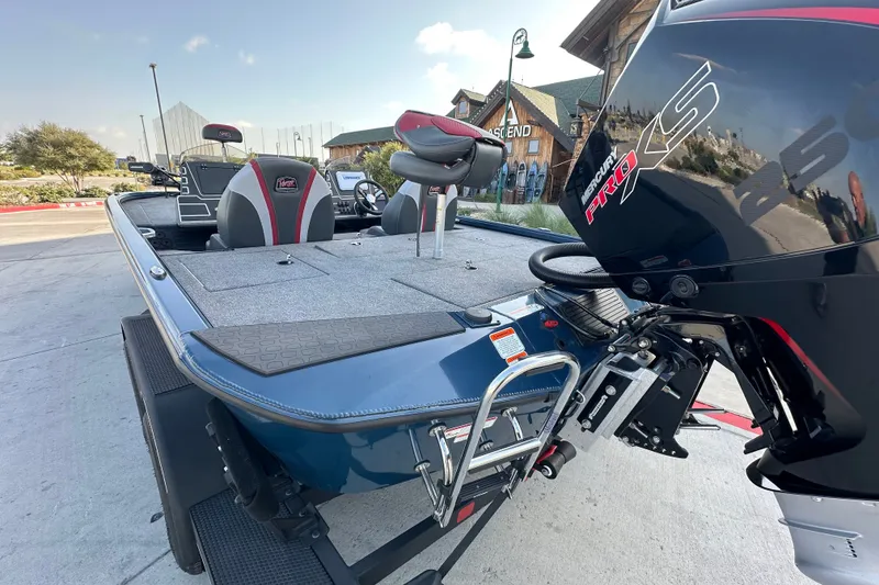 Slide: The Image of 2025 Ranger ALPHA 208 boat with Mercury Pro XS engine, docked outdoors. - 9