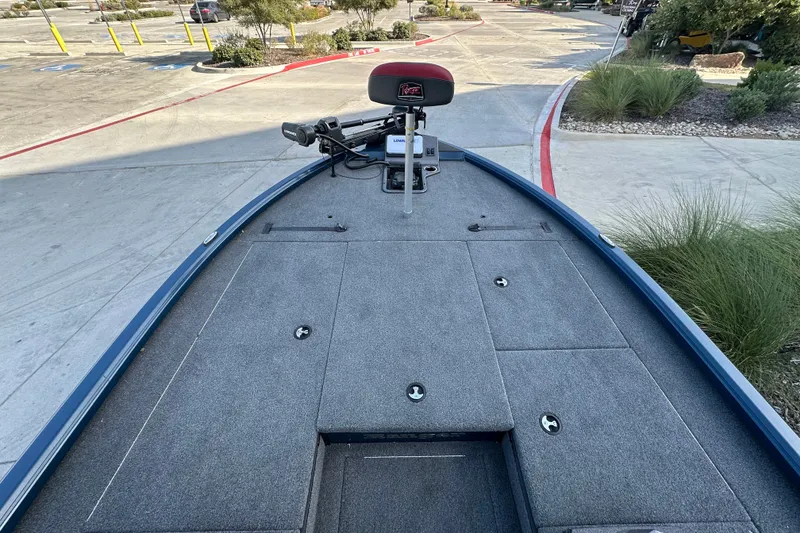 Slide: The Image of Bow view of 2025 Ranger ALPHA 208 boat with carpeted deck and trolling motor. - 24