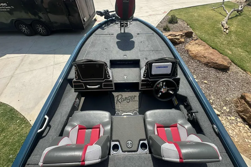 Slide: The Image of Interior view of 2025 Ranger ALPHA 208 boat with dual seats and navigation console. - 6
