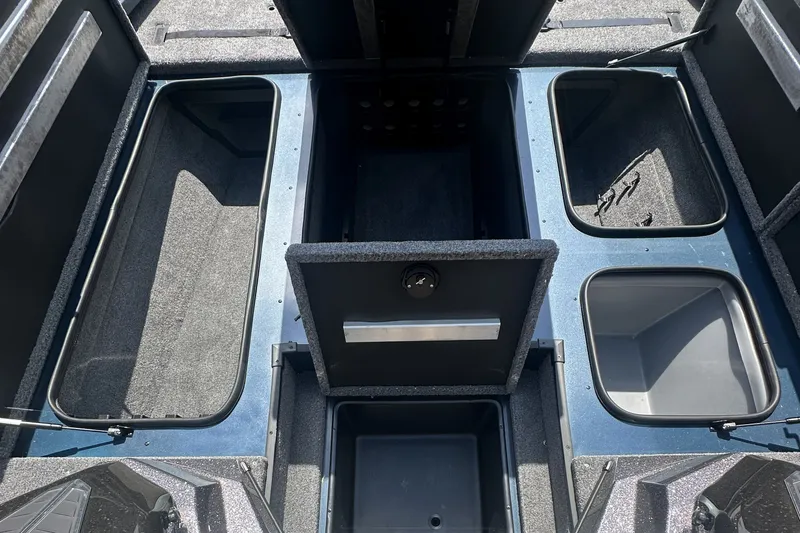 Slide: The Image of 2025 Ranger ALPHA 208 boat storage compartments, open and empty, showcasing interior layout. - 8