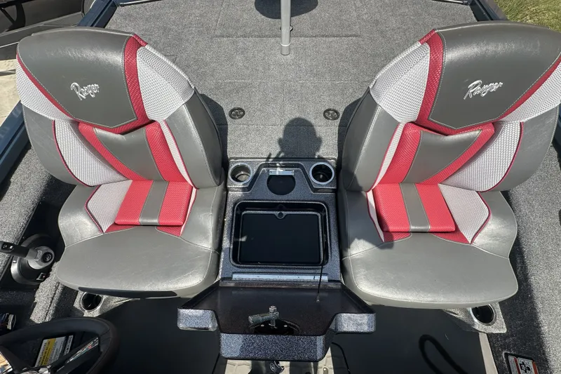 Slide: The Image of 2025 Ranger ALPHA 208 boat seats with red and gray design, featuring cup holders. - 11