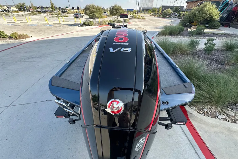 Slide: The Image of 2025 Ranger ALPHA 208 boat with powerful V8 engine, parked outdoors. - 10