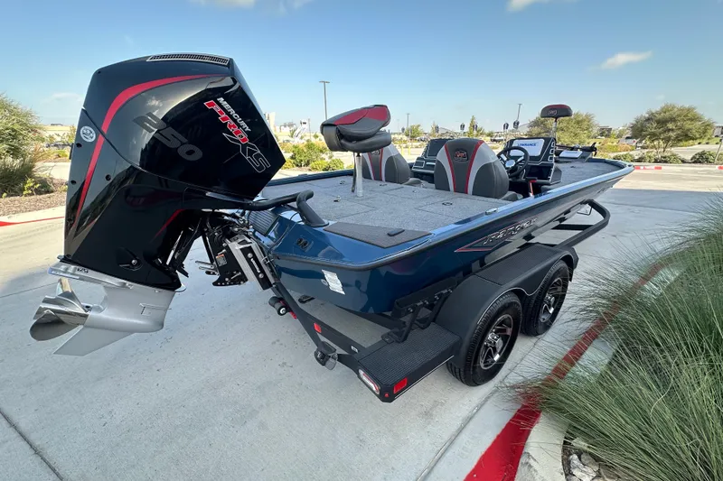 Slide: The Image of 2025 Ranger ALPHA 208 boat with Mercury Pro XS 250 engine, parked outdoors. - 11
