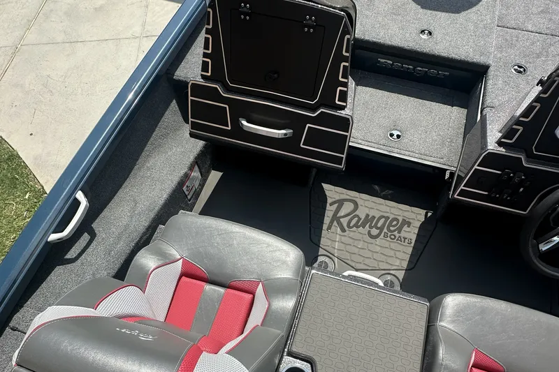 Slide: The Image of Interior of 2025 Ranger ALPHA 208 boat with stylish seating and storage compartments. - 10