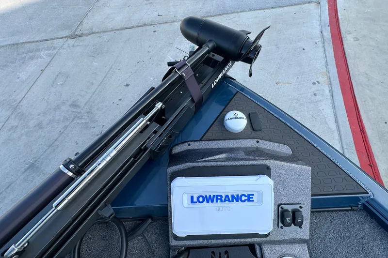 Slide: The Image of Ranger ALPHA 208 boat with Lowrance equipment, 2025 model, on concrete surface. - 27