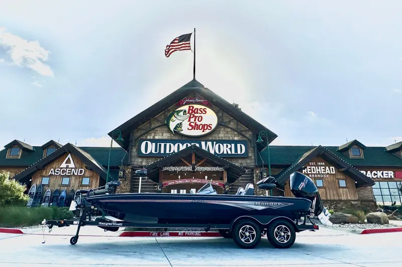 The Image of 2025 Ranger ALPHA 208 boat displayed outside Bass Pro Shops Outdoor World. - 0