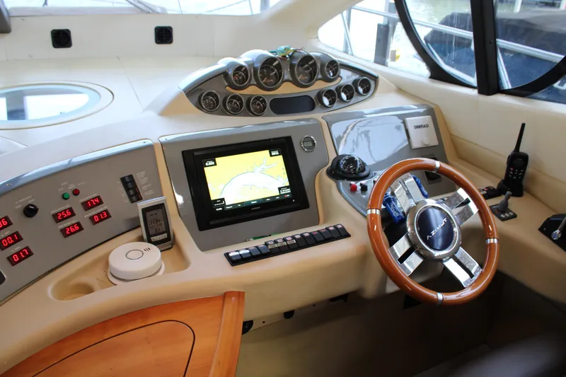 Slide: The Image of Helm of 2006 Azimut 50 yacht with navigation instruments and wooden steering wheel. - 14