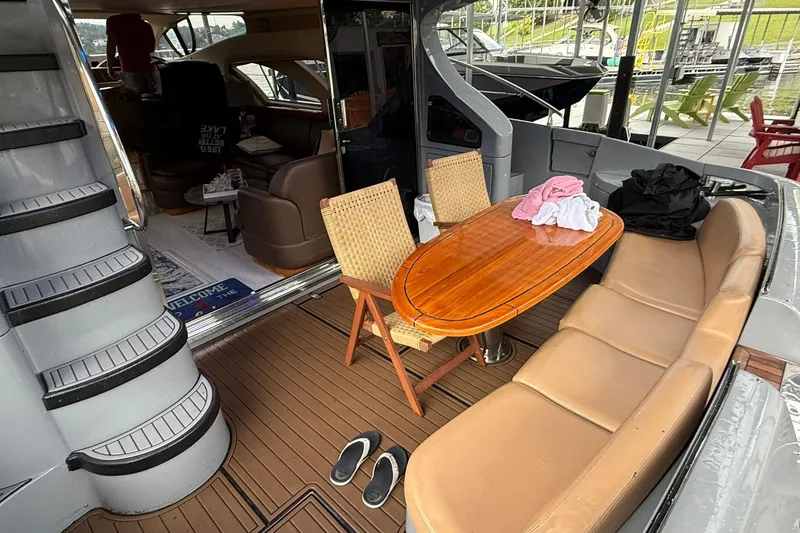 Slide: The Image of Luxurious 2006 Azimut 50 yacht interior with seating, table, and staircase. - 20