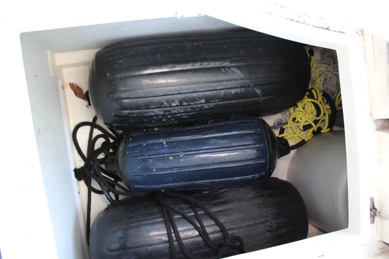 Slide: The Image of Storage compartment with boat fenders and ropes on a 2006 Azimut 50 yacht. - 30