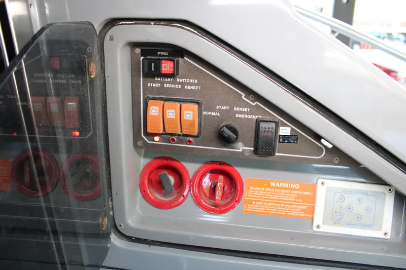 Slide: The Image of Control panel of a 2006 Azimut 50 yacht with switches and warning labels. - 31