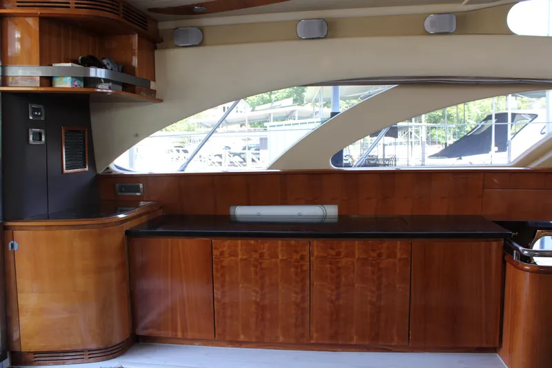 Slide: The Image of Interior of 2006 Azimut 50 yacht with wooden cabinetry and large windows. - 38
