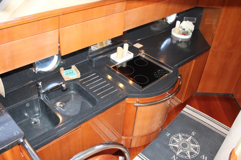 Slide: The Image of Luxurious kitchen in a 2006 Azimut 50 yacht with sleek countertops and modern appliances. - 41