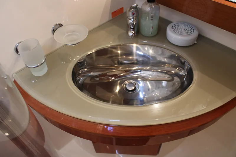 Slide: The Image of Luxury yacht Azimut 50 (2006) bathroom sink with modern fixtures and accessories. - 49