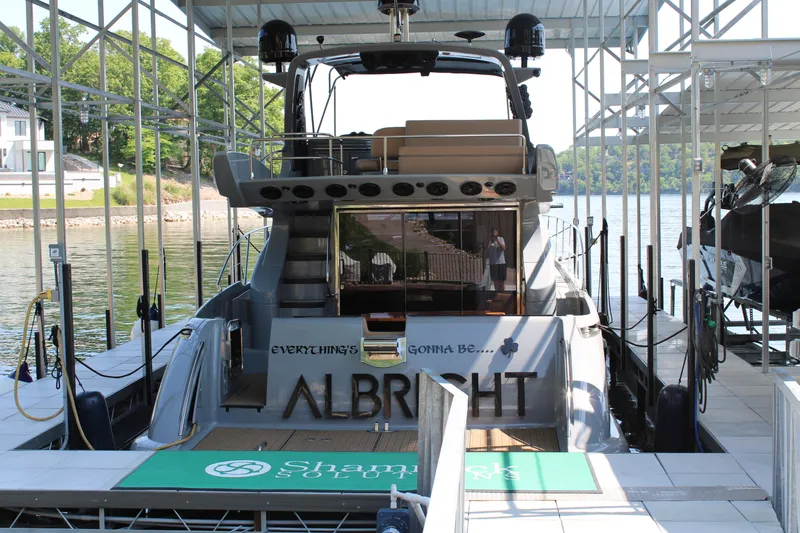 Slide: The Image of Azimut 50 yacht docked, rear view, 2006 model, with "Albright" name visible. - 5