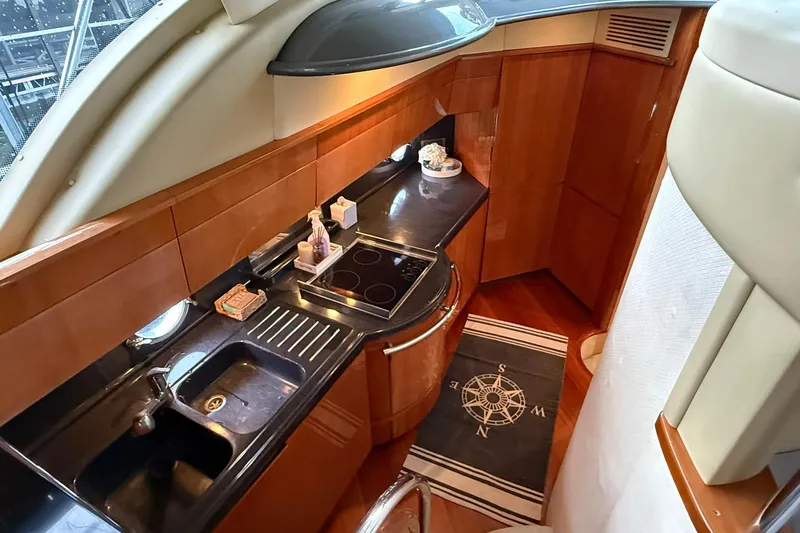 Slide: The Image of Luxurious kitchen interior of 2006 Azimut 50 yacht with modern amenities and sleek design. - 58
