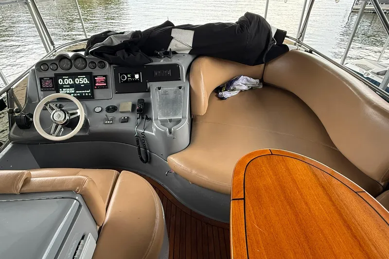 Slide: The Image of Interior of a 2006 Azimut 50 yacht with helm and seating area. - 64