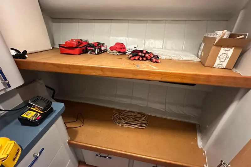 Slide: The Image of Interior of 1996 Mainship 40 Sedan Bridge with leather seating and wooden accents. - 27